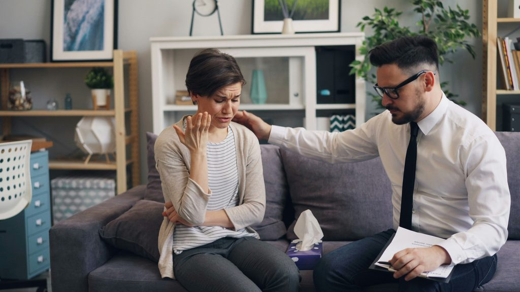 Woman receiving emotional support during fertility treatment