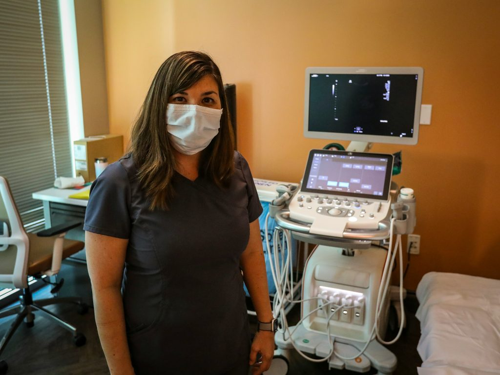 Fertility specialist reviewing ultrasound results during a consultation